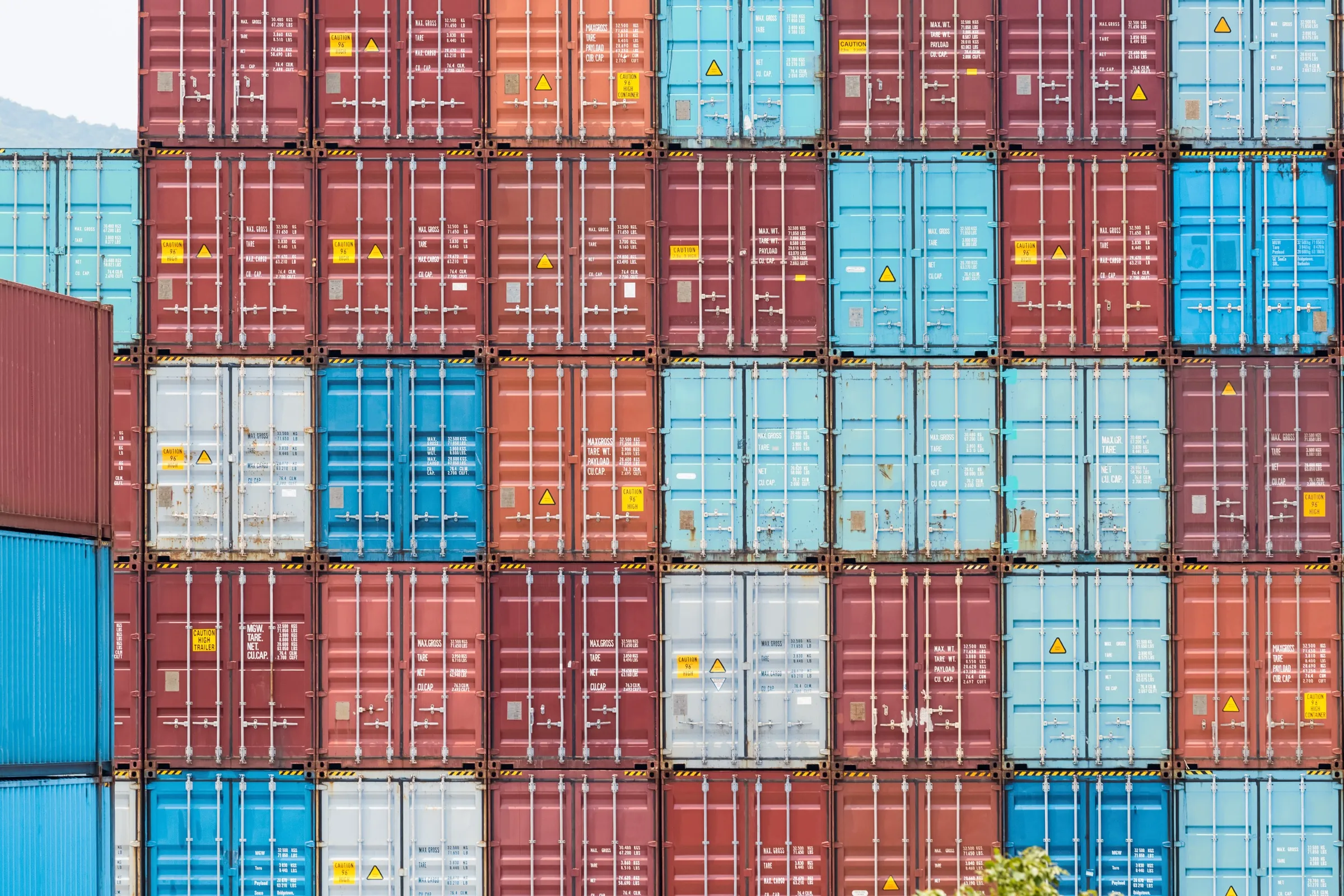 Stacked shipping containers in a container yard
